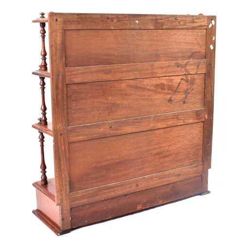 169 - A 19th century Victorian mahogany waterfall bookcase. The bookcase with twin turned column sides to ... 