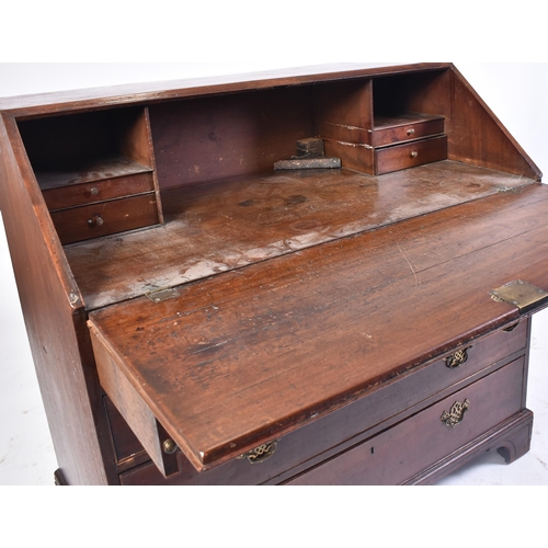 17 - A 19th century George III Cuban mahogany bureau desk. Raised on bracket feet with a series of drawer... 