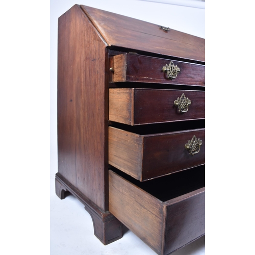 17 - A 19th century George III Cuban mahogany bureau desk. Raised on bracket feet with a series of drawer... 