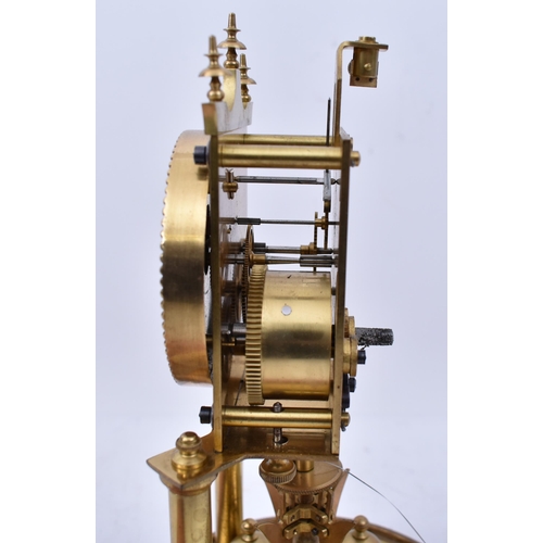 173 - A 19th century German Torsion Anniversary clock. The brass clock with swing pendulum raised on porti... 