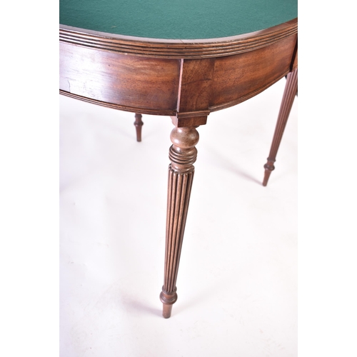 174 - A 19th century Victorian mahogany card / games table. The table of demi-lune form having a fold-over... 