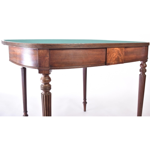 174 - A 19th century Victorian mahogany card / games table. The table of demi-lune form having a fold-over... 