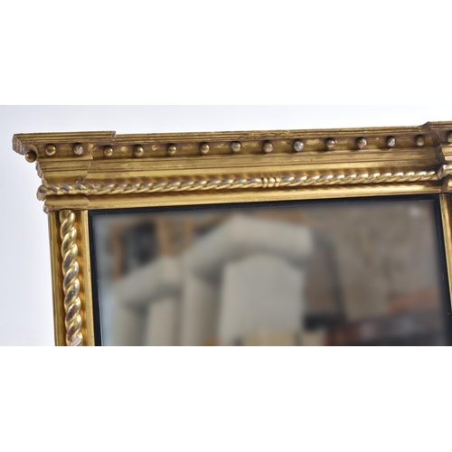 178 - A 19th century giltwood and gesso framed overmantel mirror. The mirror having flyaway cornice over b... 