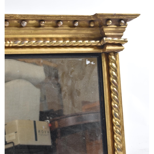 178 - A 19th century giltwood and gesso framed overmantel mirror. The mirror having flyaway cornice over b... 