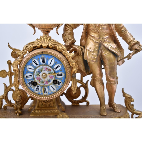 181 - A 19th century French gilt and enamel worked mantel clock. The cylinder head clock inset with Sevres... 