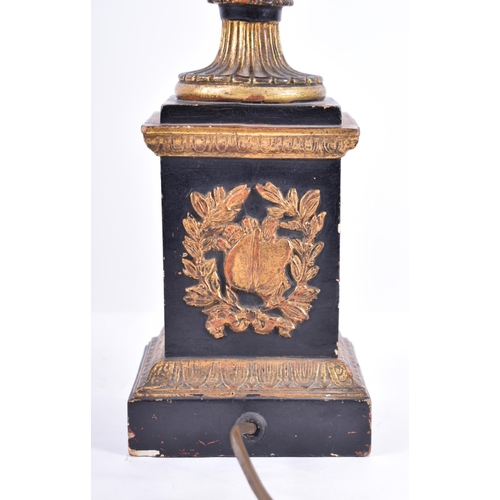 184 - An early 20th century grand tour plaster neo-classical table lamp light. The ebonised and gilt parce... 