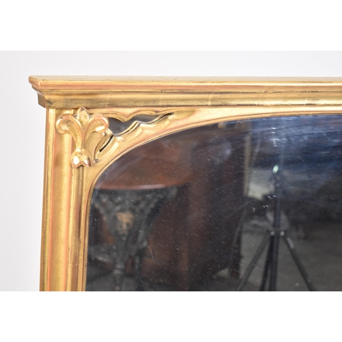 185 - A large contemporary Victorian style over mantle mirror. The mirror having a flared cornice with mou... 