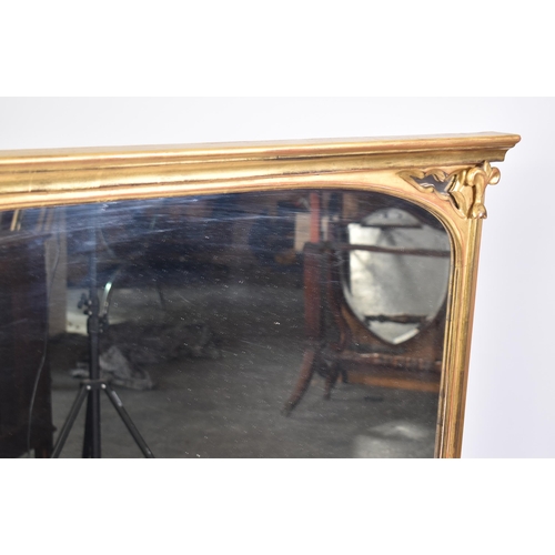 185 - A large contemporary Victorian style over mantle mirror. The mirror having a flared cornice with mou... 