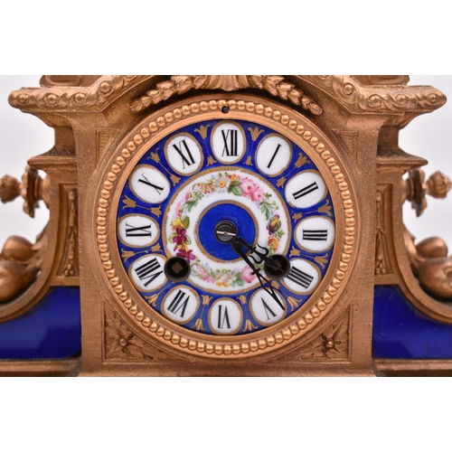 186 - A 19th century French gilt brass and enamel porcelain painted mantel clock. The clock inset with Sev... 