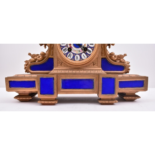 186 - A 19th century French gilt brass and enamel porcelain painted mantel clock. The clock inset with Sev... 