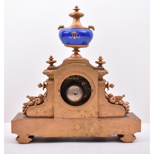 186 - A 19th century French gilt brass and enamel porcelain painted mantel clock. The clock inset with Sev... 