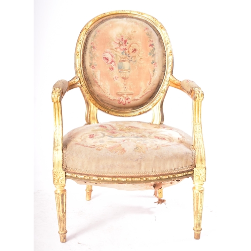 19 - A 19th century French giltwood elbow chair. The armchair having carved gilt frame with oval backrest... 