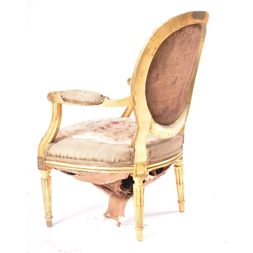 19 - A 19th century French giltwood elbow chair. The armchair having carved gilt frame with oval backrest... 