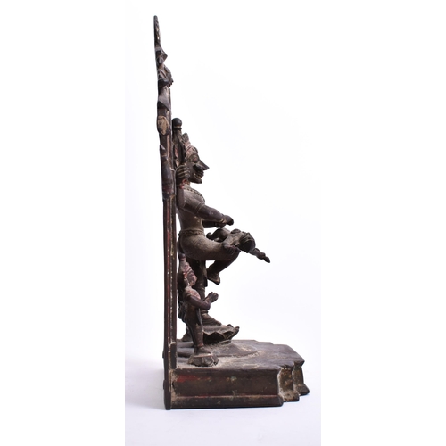 195 - A 19th century bronze altar temple sculpture depicting an Indian dancing deity. The god figure four ... 