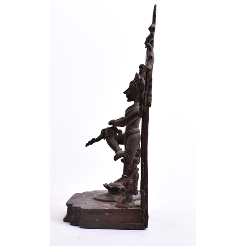 195 - A 19th century bronze altar temple sculpture depicting an Indian dancing deity. The god figure four ... 