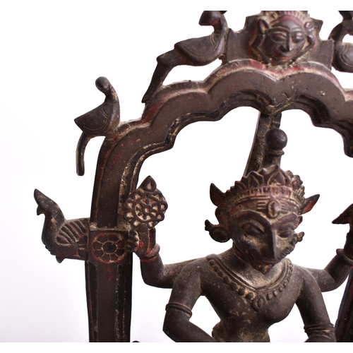 195 - A 19th century bronze altar temple sculpture depicting an Indian dancing deity. The god figure four ... 