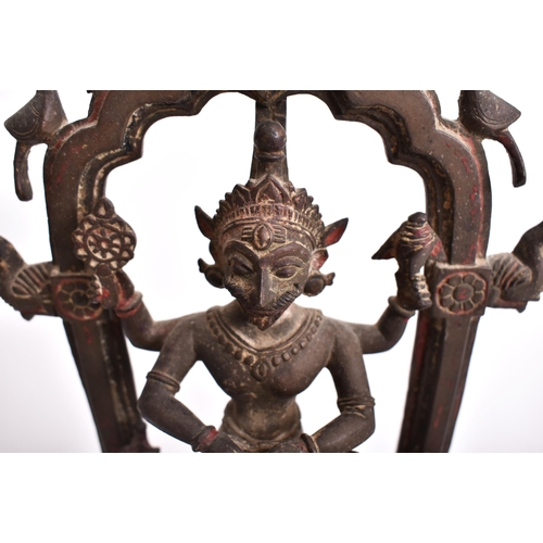 195 - A 19th century bronze altar temple sculpture depicting an Indian dancing deity. The god figure four ... 