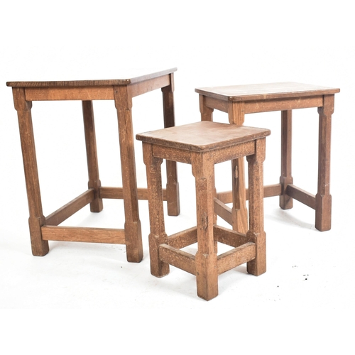 20 - Workshop of Robert Mouseman Thompson of Kilburn - an English solid carved oak nest of tables. Each t... 