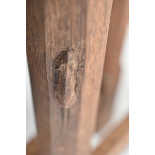 20 - Workshop of Robert Mouseman Thompson of Kilburn - an English solid carved oak nest of tables. Each t... 