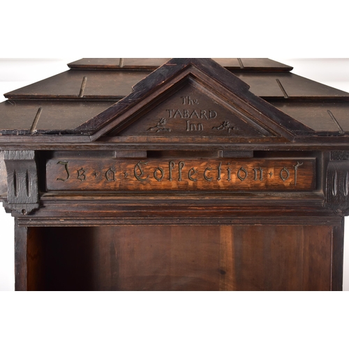 200 - An early 20th century circa 1902 American 'Tabard Inn Library' ebonised oak revolving bookcase. The ... 