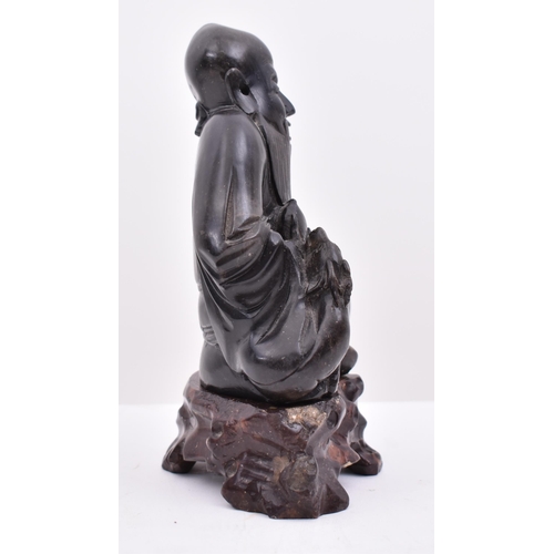 21 - A 20th century soapstone hand carved censer in form of deity of Longevity (Shao Lao). The figure sea... 