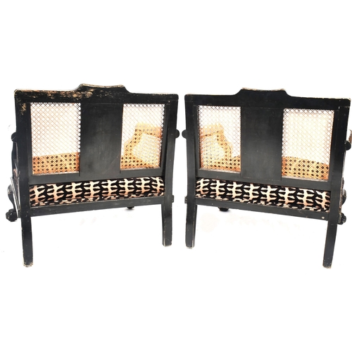 210 - A pair of early 20th century lacquered & rattan woven bergere chinoiserie low armchairs in the manne... 