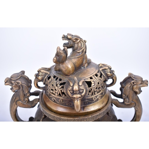 213 - A 19th century Chinese Oriental gilt bronze lidded censer. The censer having a pierced lid foo dog f... 