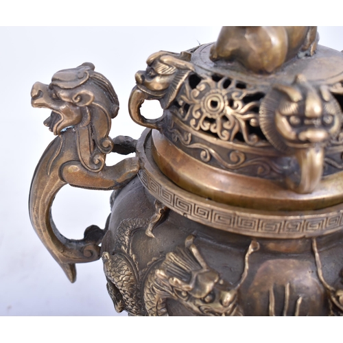 213 - A 19th century Chinese Oriental gilt bronze lidded censer. The censer having a pierced lid foo dog f... 