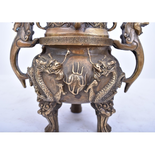 213 - A 19th century Chinese Oriental gilt bronze lidded censer. The censer having a pierced lid foo dog f... 