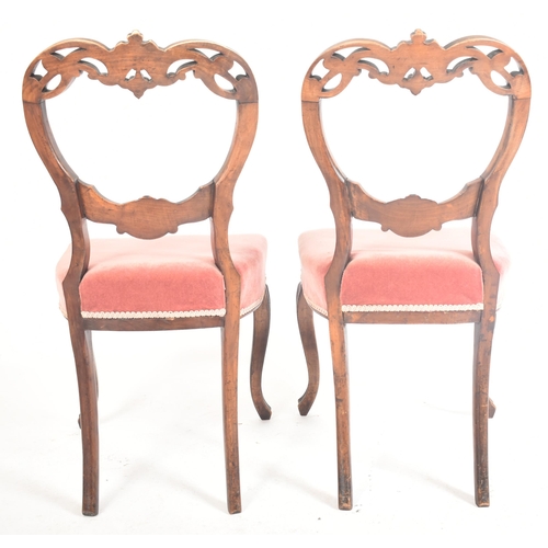 214 - A set of four late 19th century French continental carved oak spoon back dining chairs. Each chair h... 