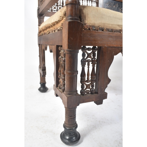 218 - A late 19th century circa 1890s Syrian Islamic carved oak hall bench / settee. The bench having intr... 