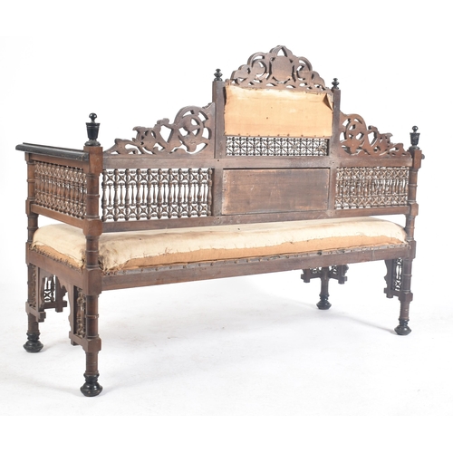 218 - A late 19th century circa 1890s Syrian Islamic carved oak hall bench / settee. The bench having intr... 