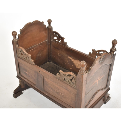 220 - A 17th century country carved oak crib - bed. The crib with sleigh rockers with inset fielded panel ... 