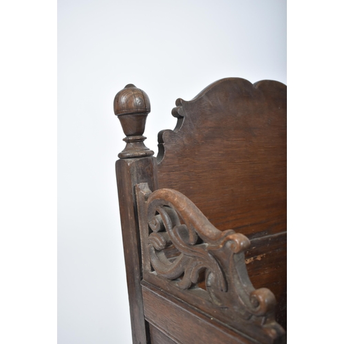 220 - A 17th century country carved oak crib - bed. The crib with sleigh rockers with inset fielded panel ... 