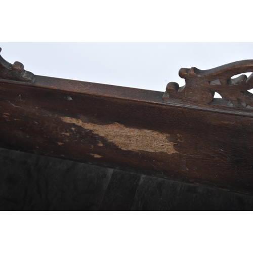 220 - A 17th century country carved oak crib - bed. The crib with sleigh rockers with inset fielded panel ... 