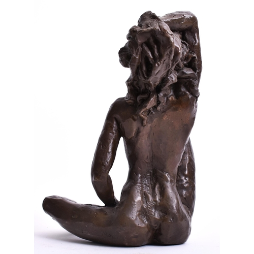 223 - After Auguste Moreau - an early 20th century French bronze sculpture of a nude woman. The woman hold... 