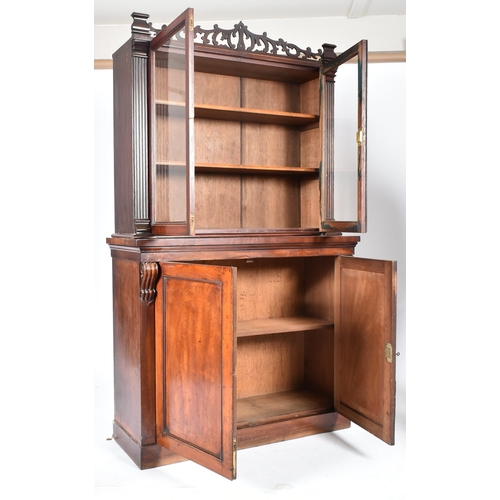 224 - A Victorian 19th century mahogany library bookcase cabinet. The bookcase having a pierced fret work ... 