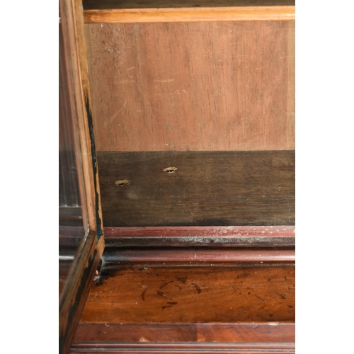 224 - A Victorian 19th century mahogany library bookcase cabinet. The bookcase having a pierced fret work ... 