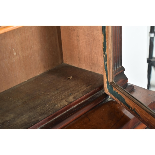 224 - A Victorian 19th century mahogany library bookcase cabinet. The bookcase having a pierced fret work ... 