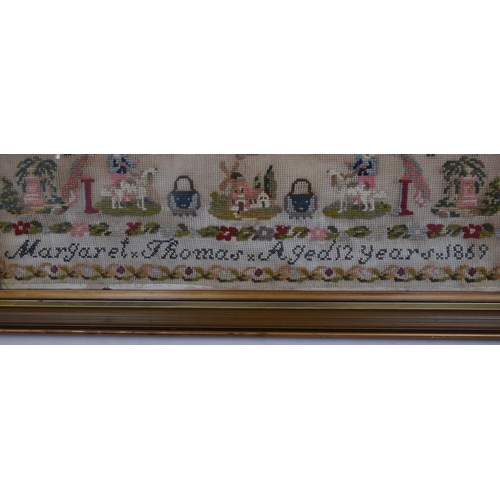 225 - A Victorian 19th century 1869 hand embroidered needlepoint sampler by Margaret Thomas aged 12 years ... 