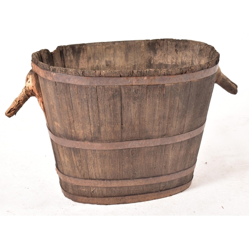 231 - An early 20th century circa 1900s French continental oak grape harvesting bucket / bin. The bucket h... 