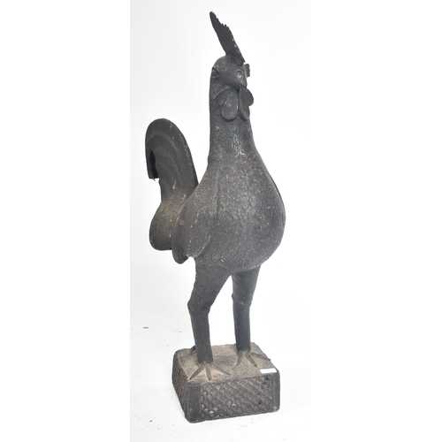 235 - A large cast metal rooster - cockerel  of Dahomey, Benin origin. Cast metal and ebonised being raise... 