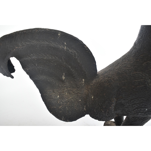 235 - A large cast metal rooster - cockerel  of Dahomey, Benin origin. Cast metal and ebonised being raise... 