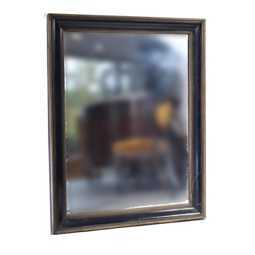 236 - A pair of 19th century Victorian mahogany and brass framed mirrors. Each mirror with deep cushioned ... 