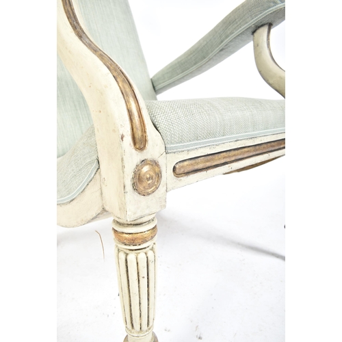 241 - A 19th century Swedish painted easy armchair. The painted easy chair being raised on reeded tapering... 