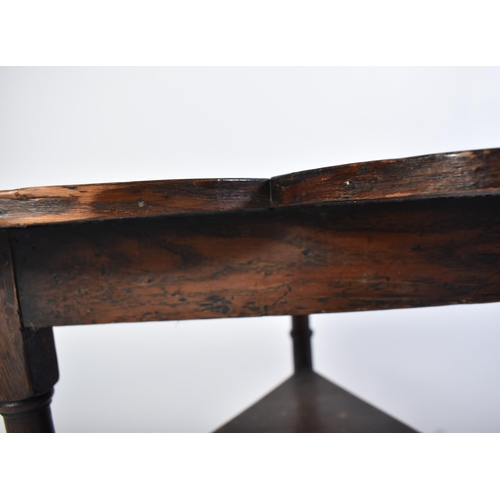 243 - A part 17th century oak clover table. The 17th century oak base of turned leg form with peripheral s... 