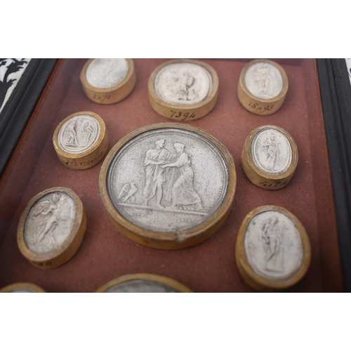 251 - A selection of 19th century Grand Tour plaster intaglios / seals. Each depicting classical figures s... 