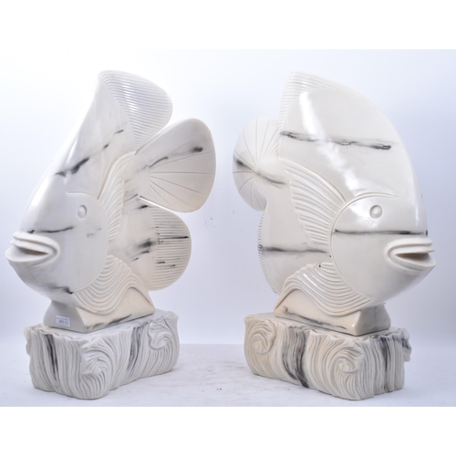 260 - A pair of large vintage 20th century Art Deco inspired resin fish sculptures on stands Each fish in ... 