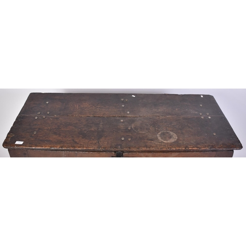 261 - A George III 18th century oak coffer blanket box. The chest having a hinged top with studded joints ... 