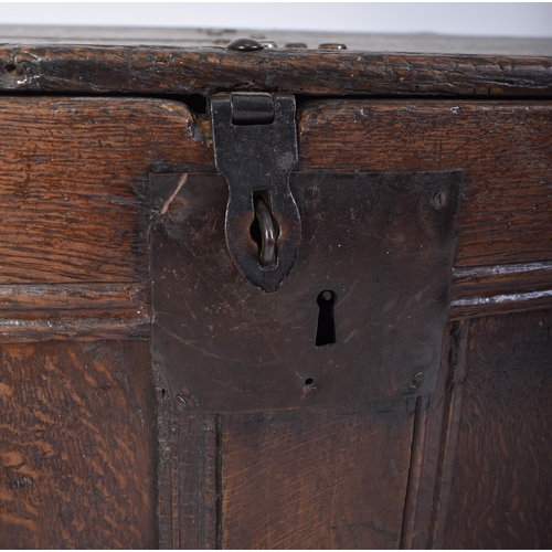 261 - A George III 18th century oak coffer blanket box. The chest having a hinged top with studded joints ... 